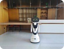 Load image into Gallery viewer, Timo AI reception robot — at a front desk