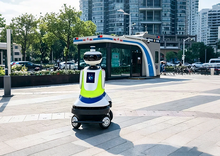 Load image into Gallery viewer, CatCop security patrol robot in a commercial complex
