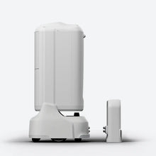 Load image into Gallery viewer, FlashBot Max beside its charging dock, shown from the side
