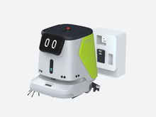 Load image into Gallery viewer, PUDU CC1 cleaning robot beside its charging dock
