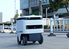 Load image into Gallery viewer, Speedybot Pro indoor and outdoor delivery robot in a shopping mall
